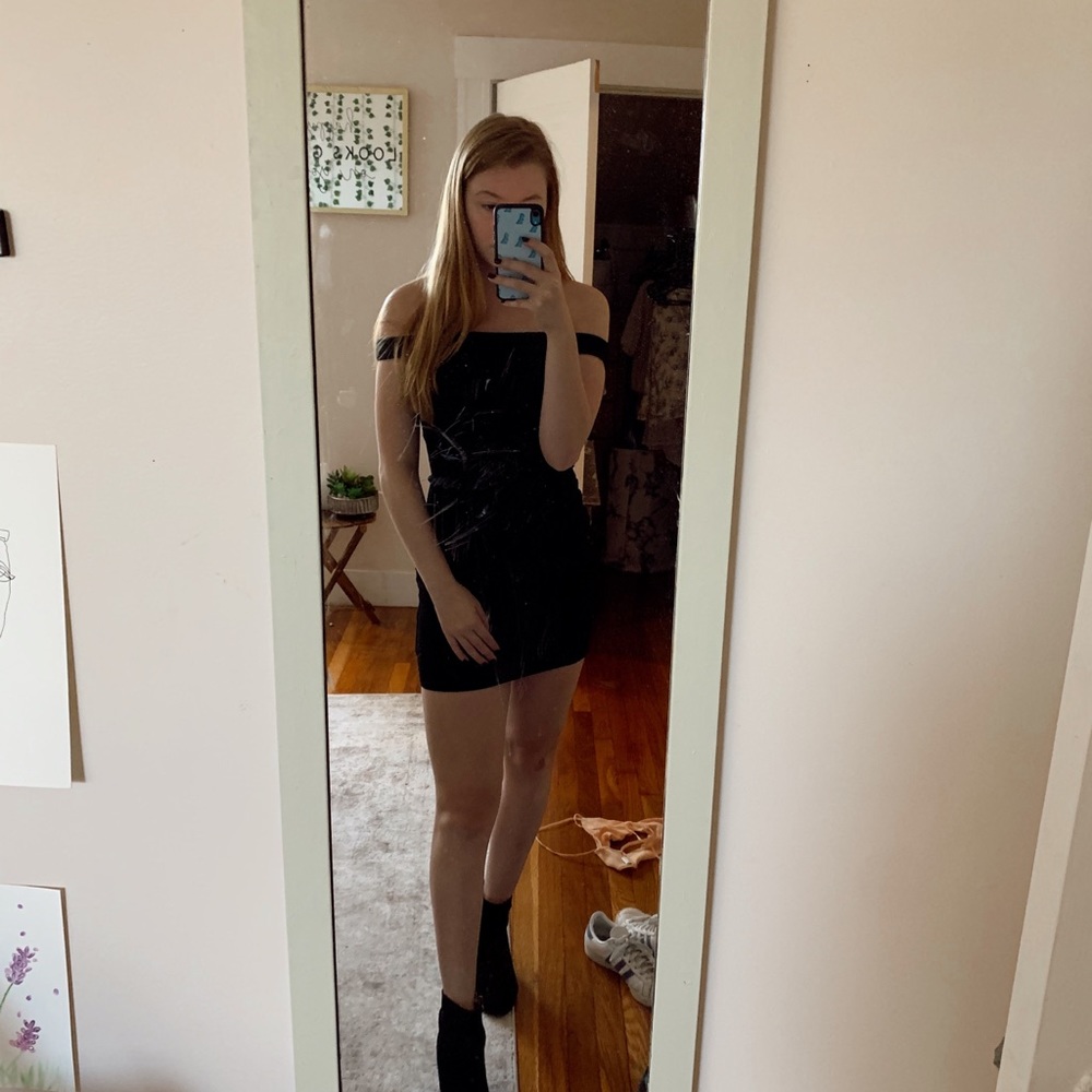 In Awe little black off the shoulder dress.